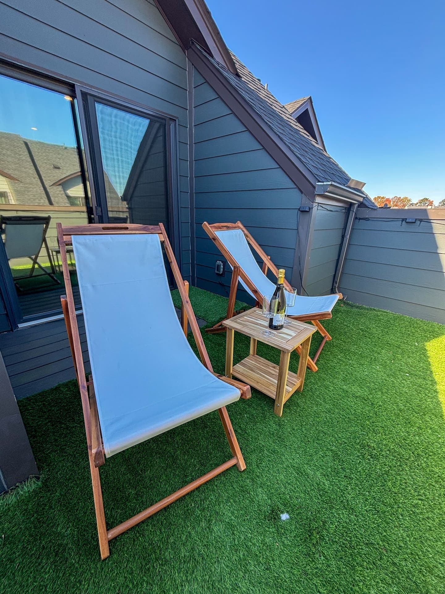Private rooftop terrace with turf and lounge chairs